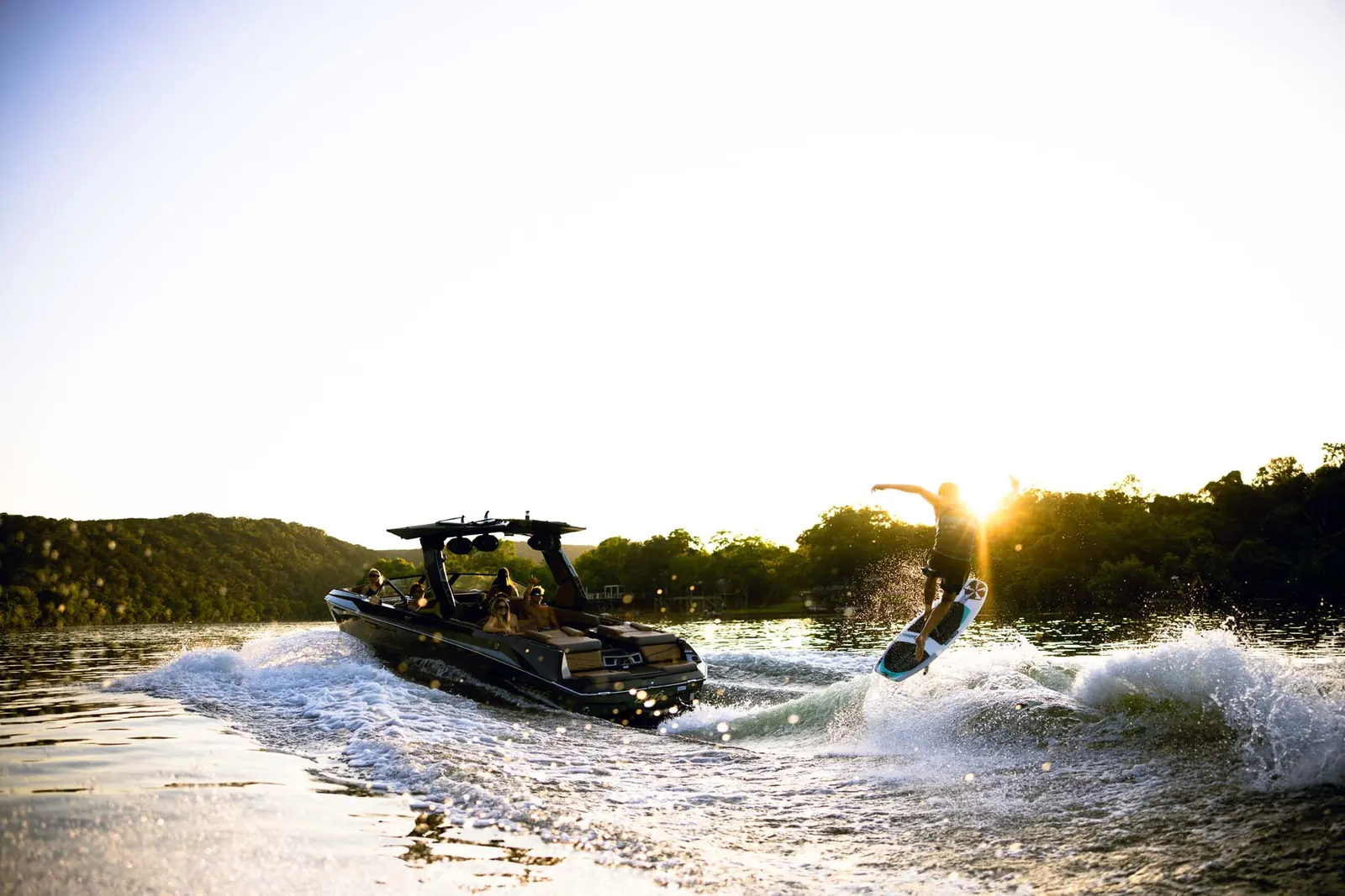 People aboard a 2027 Tige Ultré 25ZX on the water (manufacturer image)