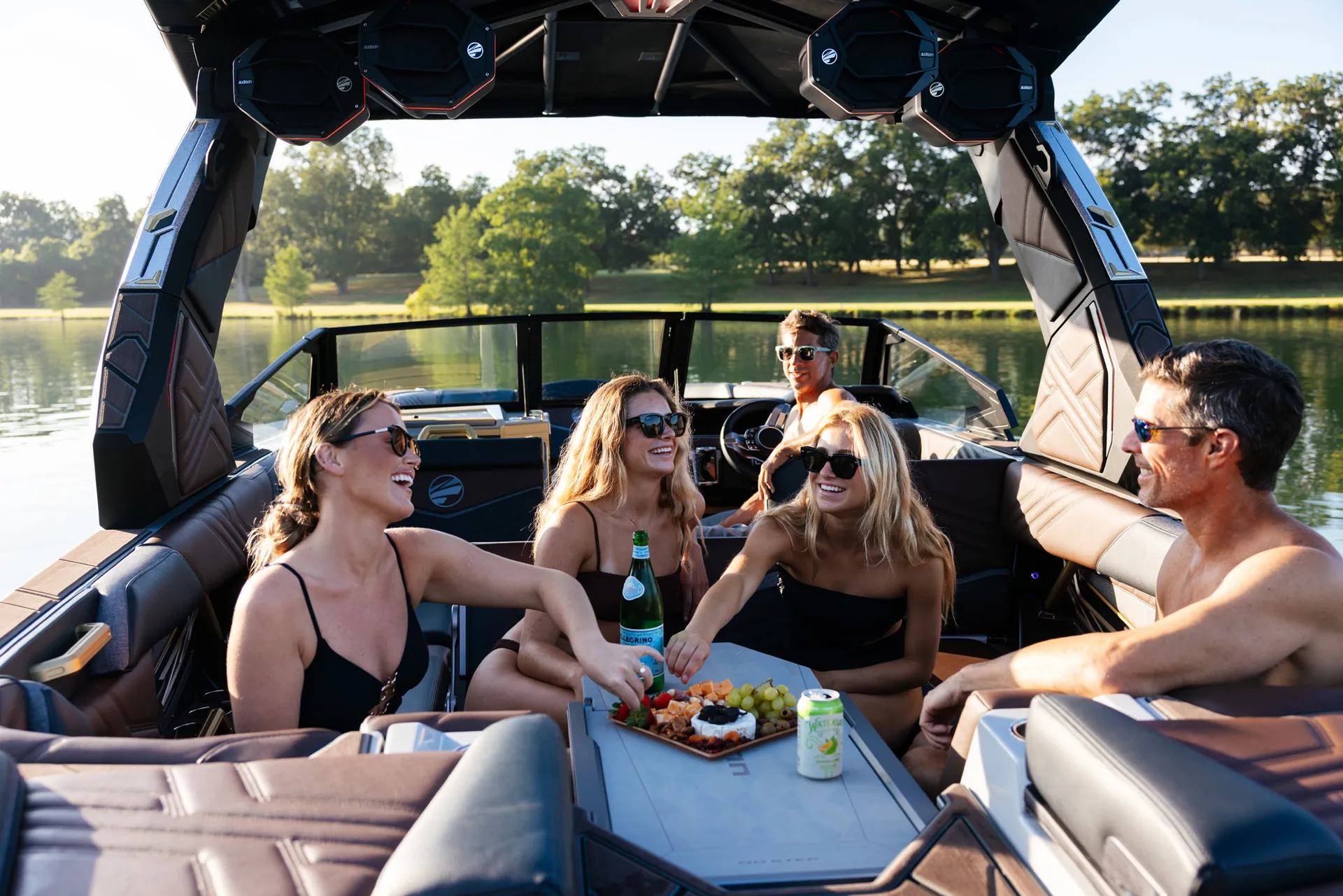 People aboard a 2026 Tige Ultré 25ZX on the lake (manufacturer image)